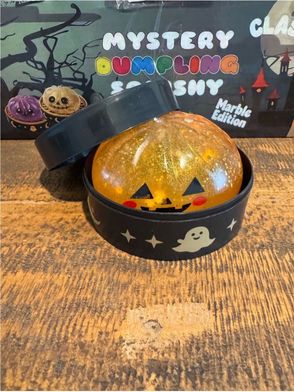 Halloween Pumpkin Dumpling Glitter Squishy w/ Storage Case - Orange Sensory Toy - Picture 3 of 8